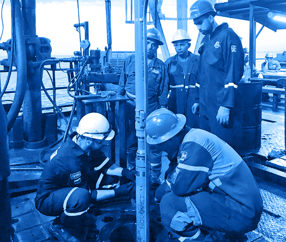 Rig floor shot of rotary a rotary displacement cylindrical pump being installed on a heavy-oil well 